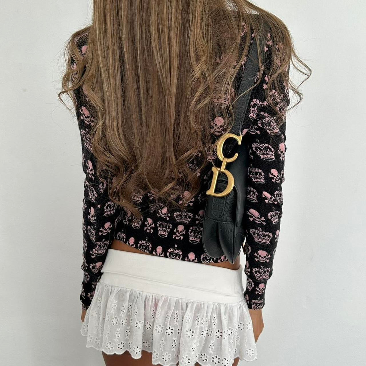 Vintage 90’s pink skull and crossbones cardigan