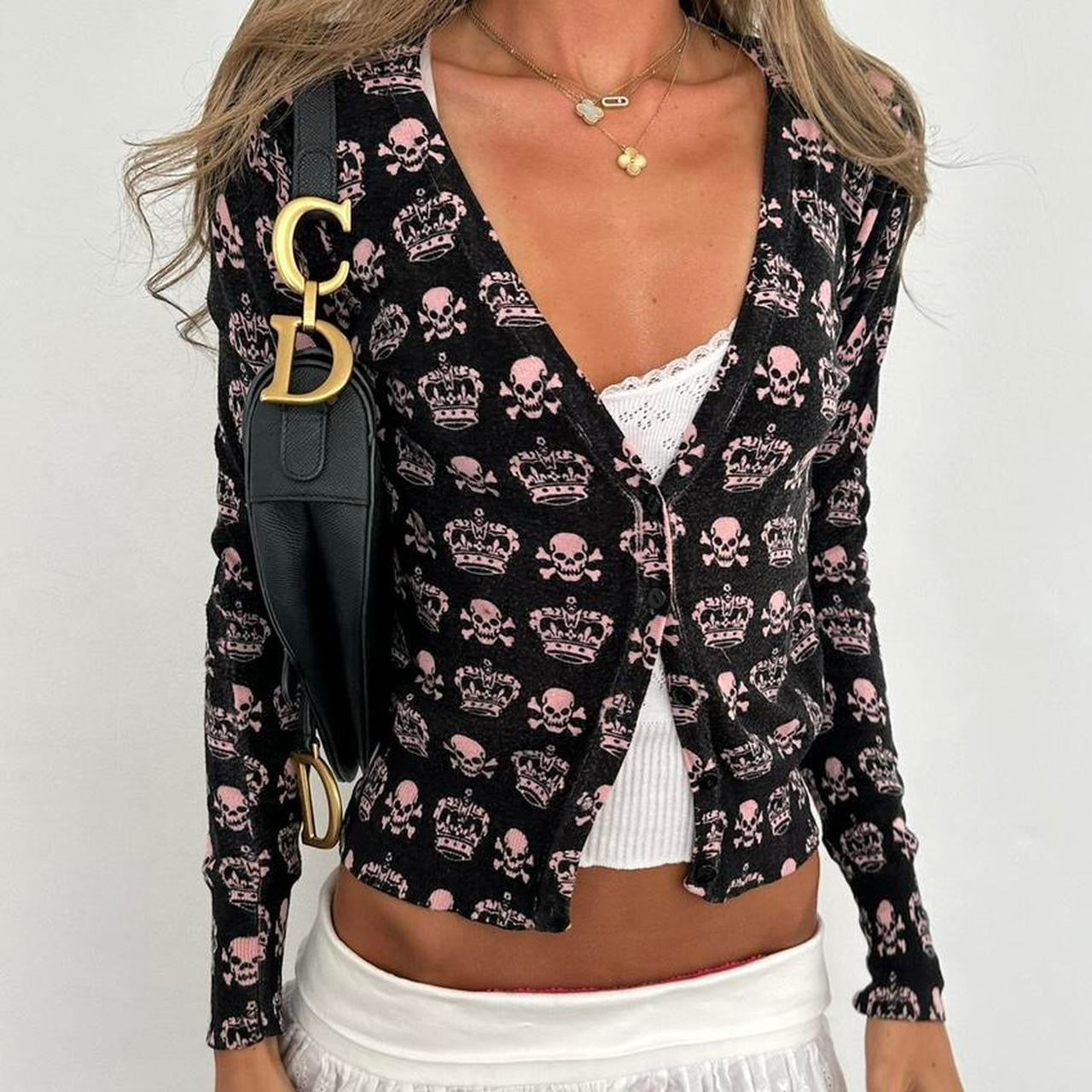Vintage 90’s pink skull and crossbones cardigan