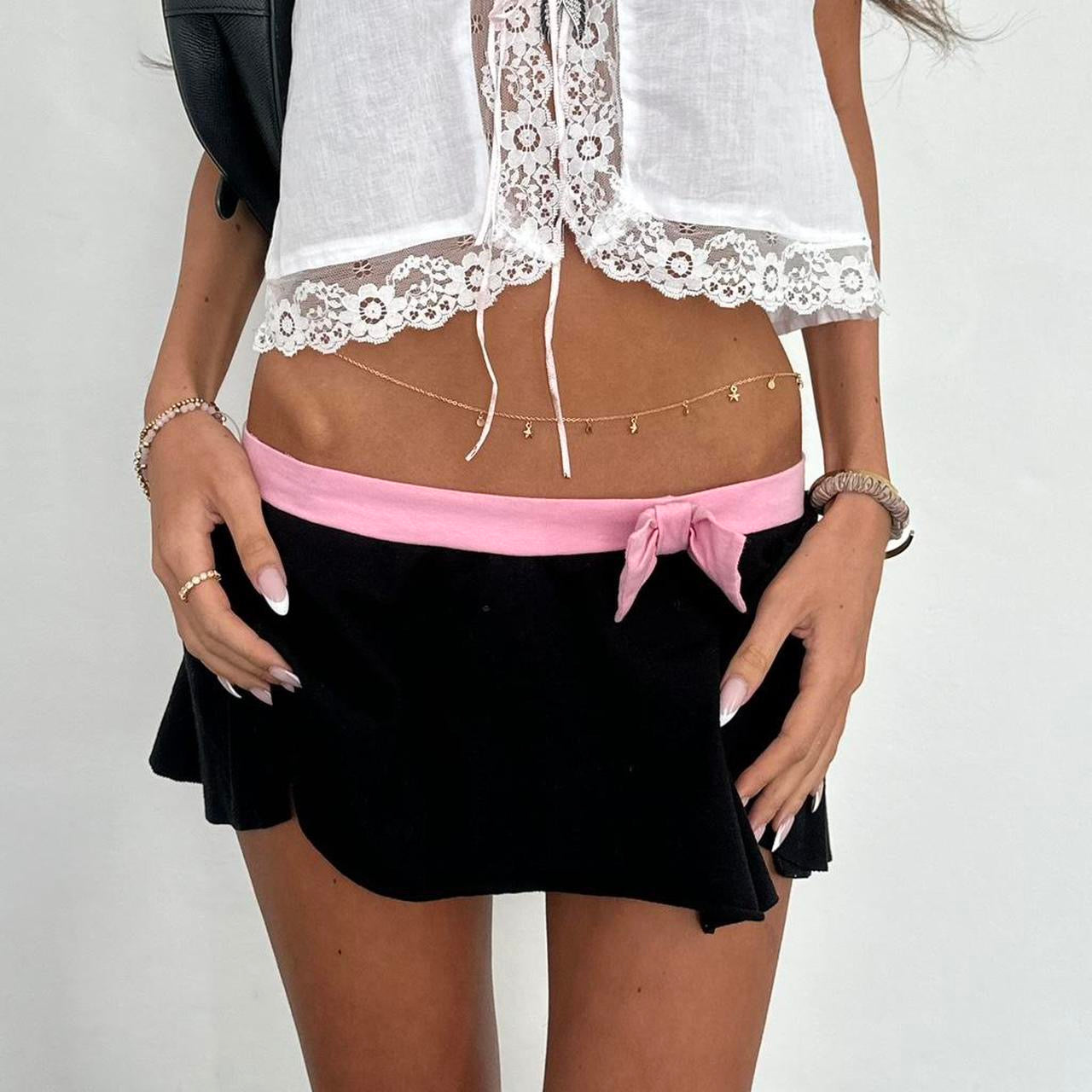 Vintage 90’s black mini skirt with pink bow