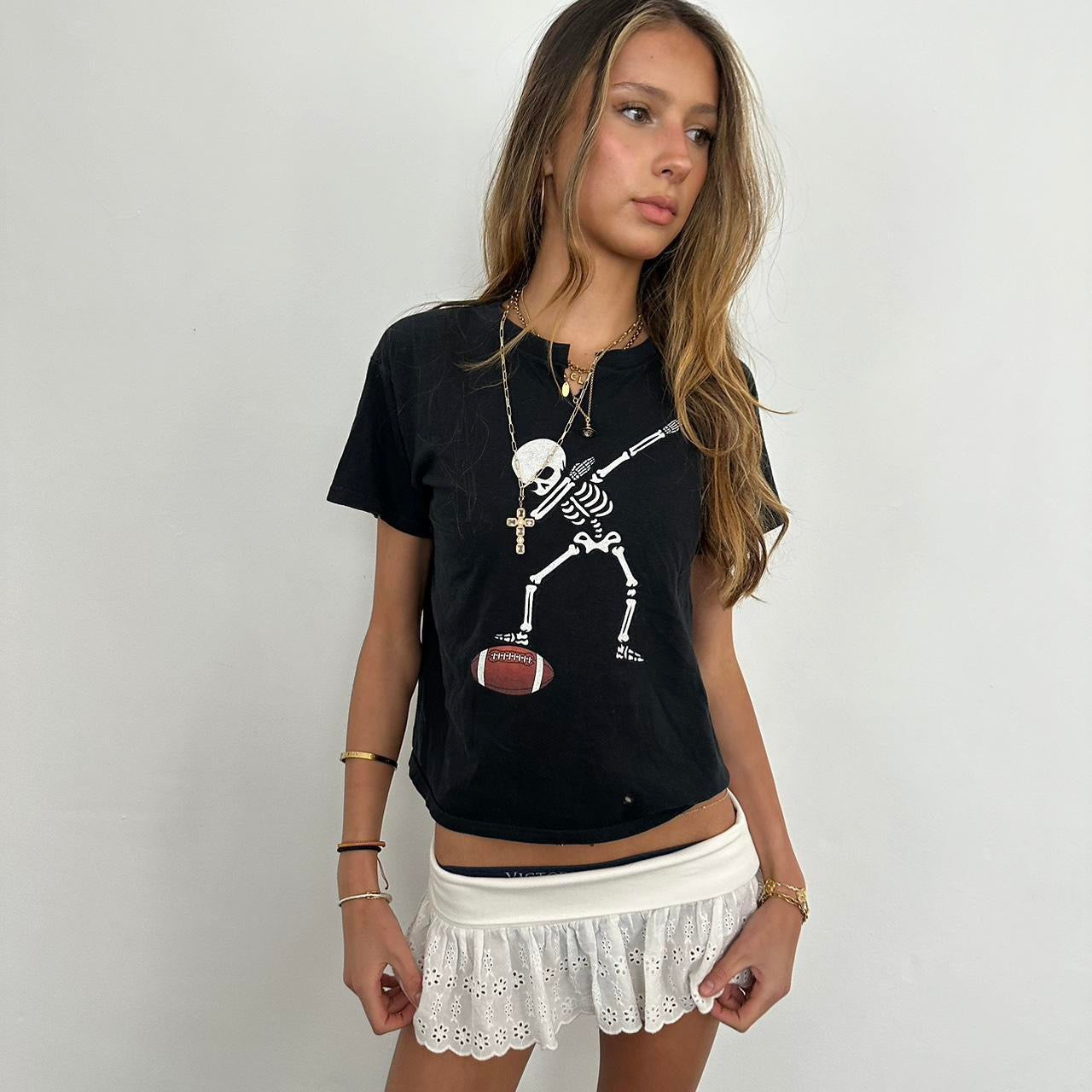 Vintage black skeleton football baby tee