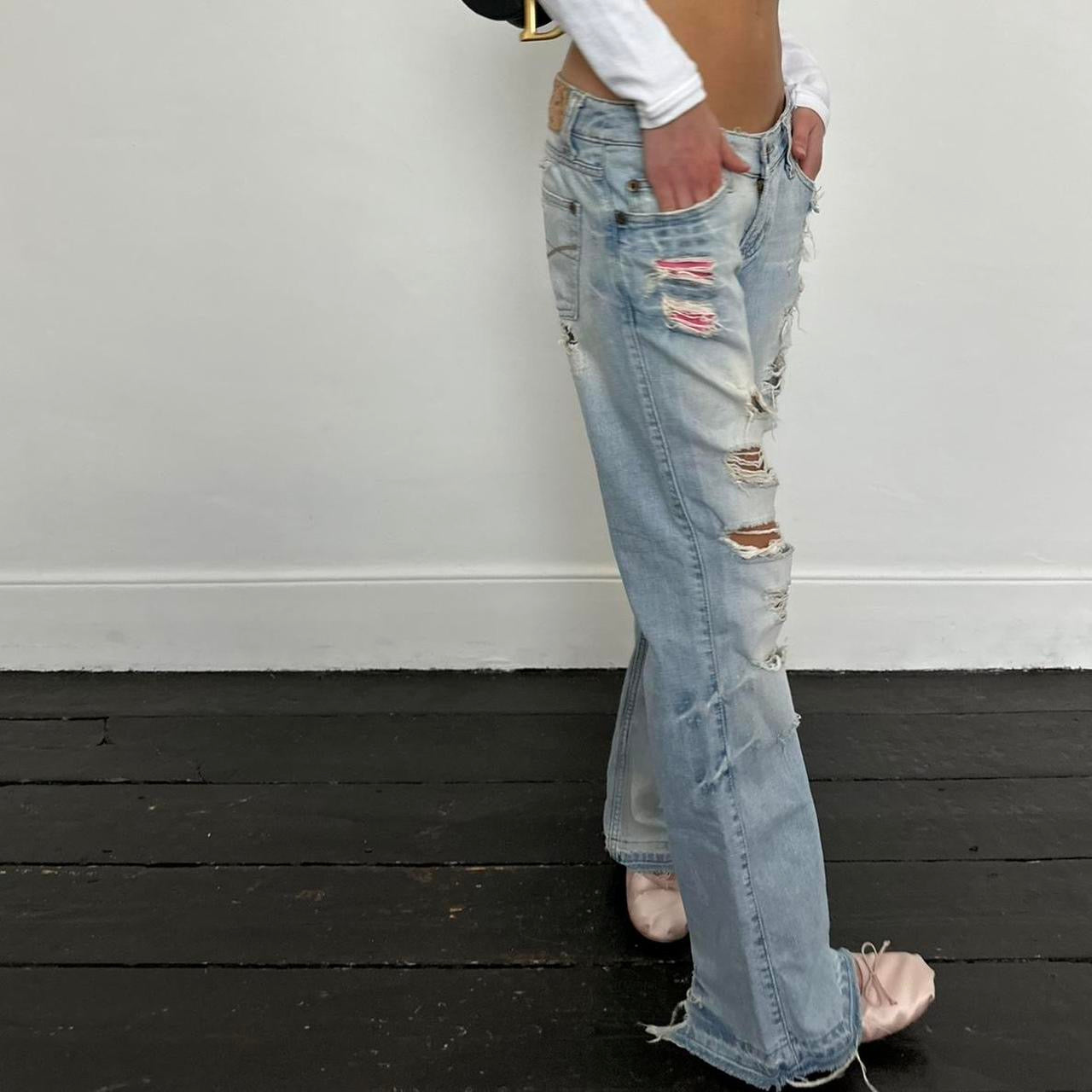 Vintage 2000’s blue distressed bootcut jeans