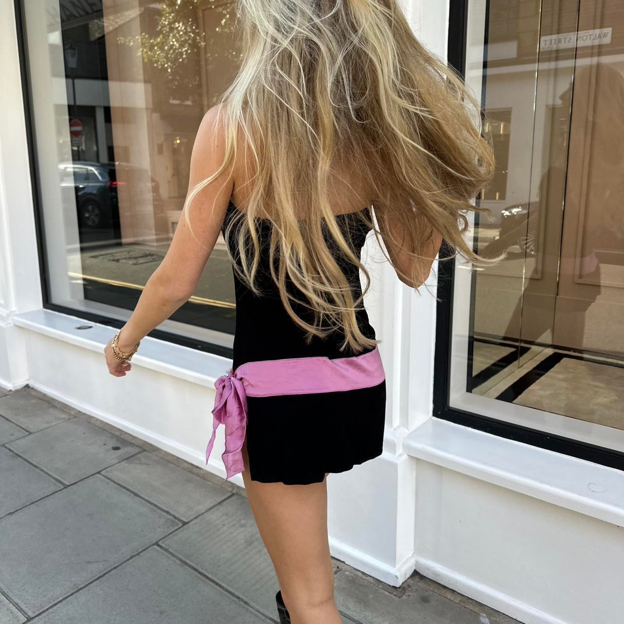 Vintage 2000’s strapless black mini dress with pink bow