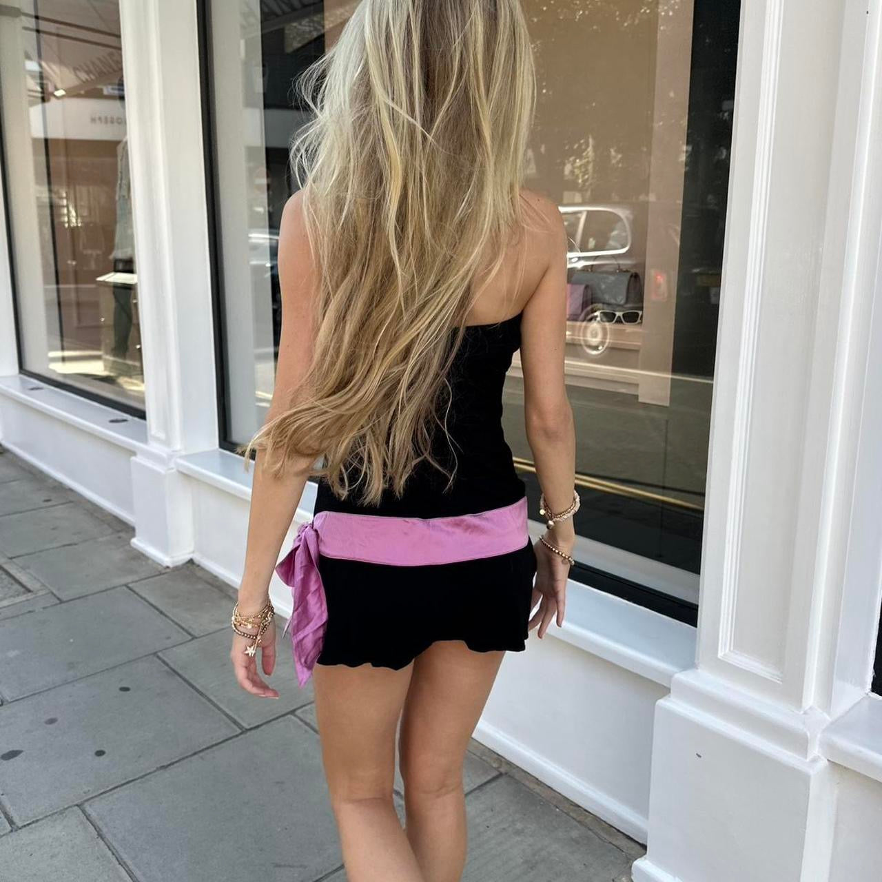 Vintage 2000’s strapless black mini dress with pink bow