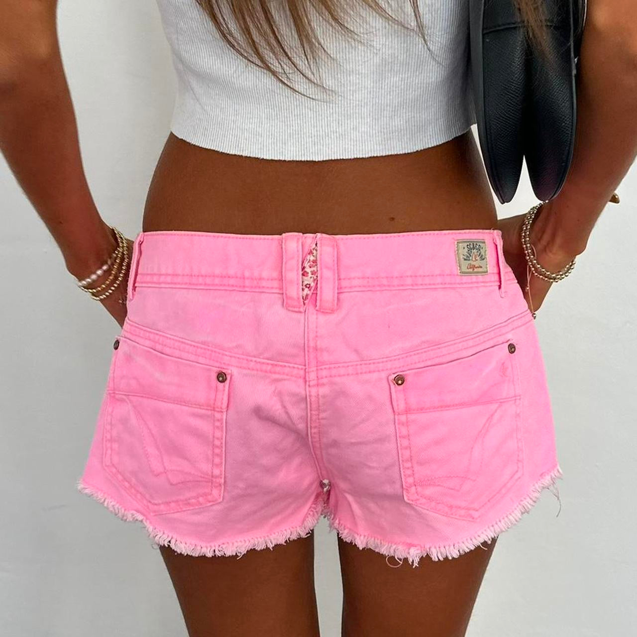 Vintage pink and floral distressed denim shorts