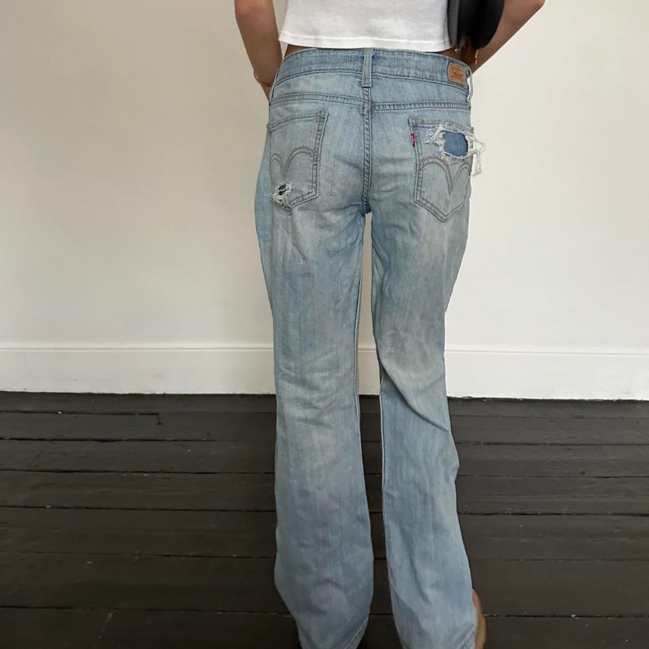 Vintage Levis blue wash distressed jeans